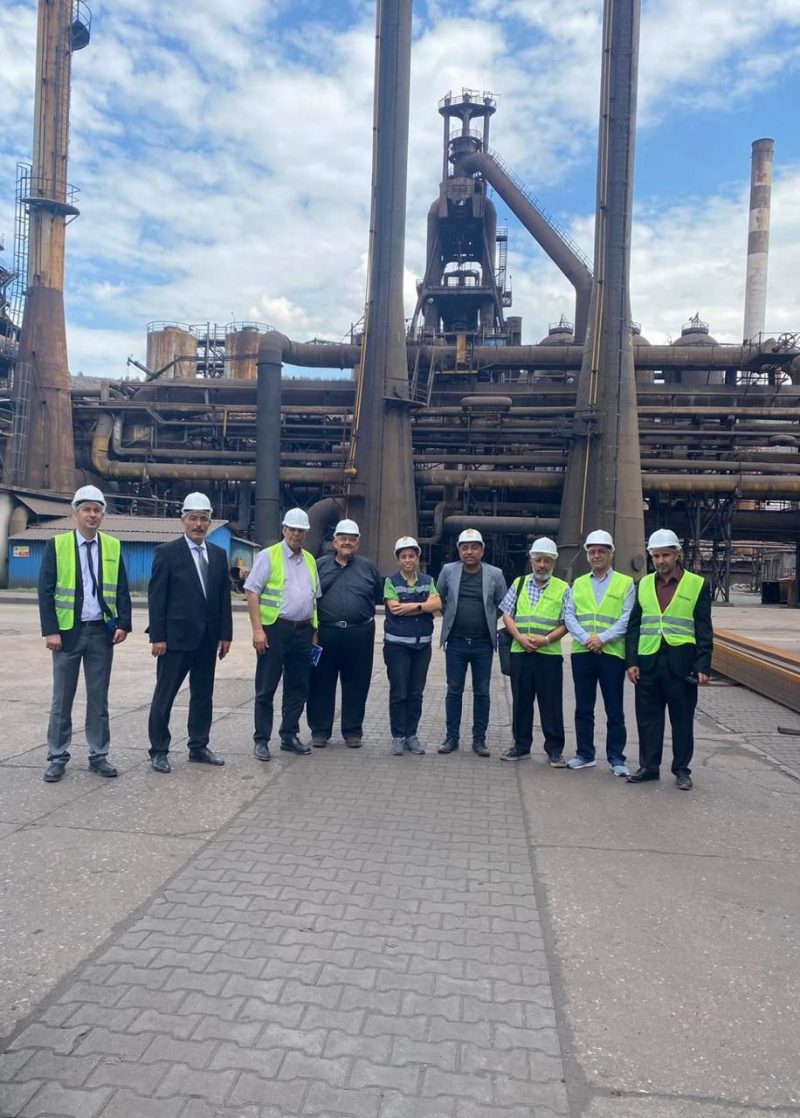 AL-WASET team with partner engineers in front of an industrial plant