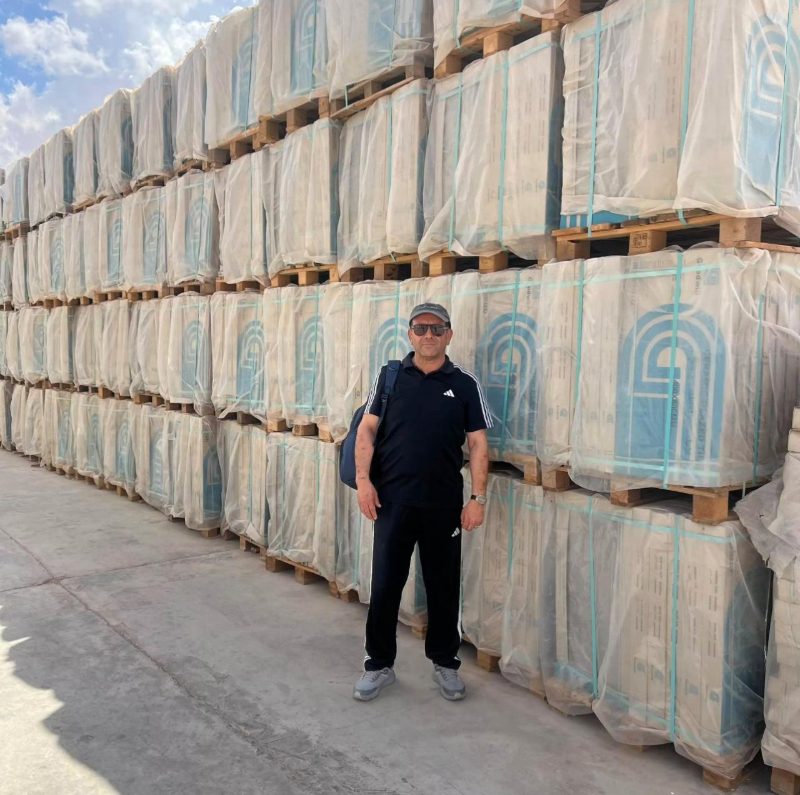 Warehouse stacked with palletised building materials ready for distribution